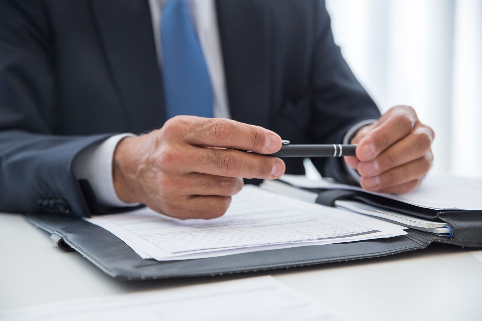 cpa reviewing documents at desk